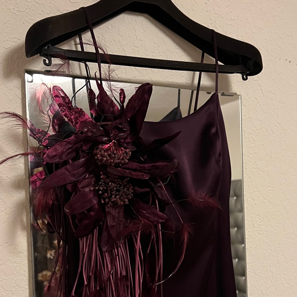 Elegant Dark Purple Gown with Feather Detail